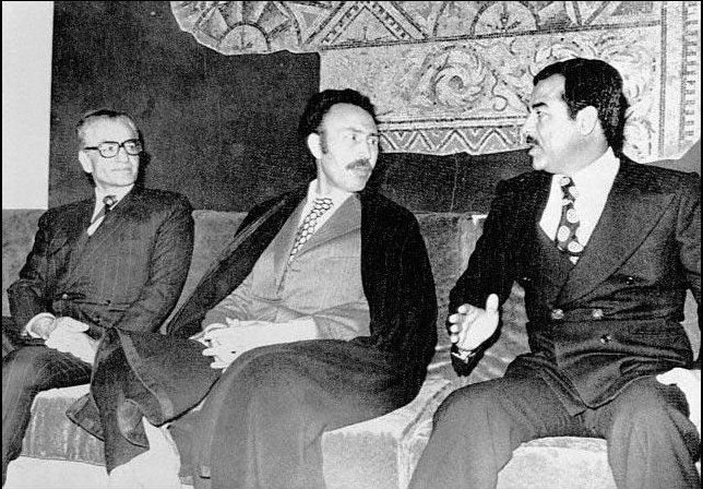 Mohammad Reza Pahlavi, Houari Boumédiène, and Saddam Hussein (left to right) during the signing of the 1975 Algiers Agreement, which reshaped Iran–Iraq border relations.